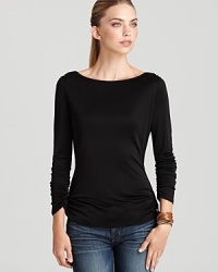 A silky, slinky Trina Turk top with flattering ruched details and a stylish draped back--a versatile layering piece that can stand on its own. A silky, slinky Trina Turk top with flattering ruched details and a stylish draped back--a versatile layering piece that can stand on its own.