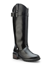 Boot camp. In a salute to military style, these tall boots get chic straps and shiny studs. From UGG® Collection. Boot camp. In a salute to military style, these tall boots get chic straps and shiny studs. From UGG® Collection.
