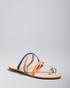 Loeffler Randall gives barely-there strappy sandals get-noticed style, mixing colorful and metallic straps in a toe ring thong design.