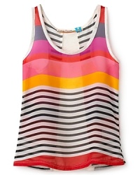 Her lighter-than-air summer look is the striped chiffon tank top, contrasted with a solid back panel. Her lighter-than-air summer look is the striped chiffon tank top, contrasted with a solid back panel.