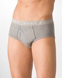 Gusset construction for support and comfort in a traditional brief silhouette. Signature logo waistband. Multi pack in black, white and grey. Gusset construction for support and comfort in a traditional brief silhouette. Signature logo waistband. Multi pack in black, white and grey.