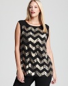 Sparkling chevron stripes lend disco-era glamour to a VINCE CAMUTO Plus blouse for a retro-chic statement.