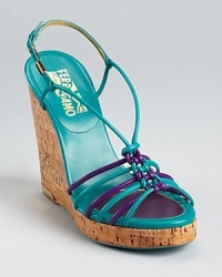 This strappy, bi-color design from Salvatore Ferragamo works for both day and night. A cork wedge adds covetable contrast to luxe leather. This strappy, bi-color design from Salvatore Ferragamo works for both day and night. A cork wedge adds covetable contrast to luxe leather.