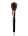 EXCLUSIVELY AT SAKS. An all purpose brush that glides soft and sensual against the skin for meticulous coverage. It provides a smooth even finish with a full dome shape assembled of sumptuous natural bristles, designed for applying pressed powder, loose powder and bronzing powder 