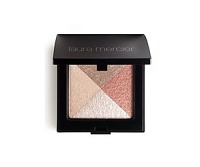 Laura Mercier Shimmer Bloc is a unique baked formula that applies effortlessly while brightening the eyes, cheeks & body with a hint of natural colour & light. Contains light-reflecting properties that blend together to give the skin a healthy all-over glow.