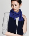 Crisp color blocking lends a trend-right finish to a cashmere Magaschoni scarf. Slip on the style for instant chic.