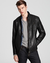 With a moto-inspired silhouette, HUGO BOSS' Jips jacket lends a rugged look in leather. With a moto-inspired silhouette, HUGO BOSS' Jips jacket lends a rugged look in leather.