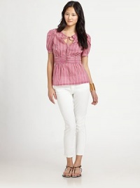 This feminine, prettily ruched style is printed with a cheerful signature pattern.Vented jewel neckline with drawstring self tieShort puffed sleeves with button cuffsRuched waistbandConcealed side zipAbout 22¼ from shoulder to hemCottonDry cleanImportedModel shown is 5'10 (177cm) wearing US size 4.OUR FIT MODEL RECOMMENDS ordering true size. This feminine, prettily ruched style is printed with a cheerful signature pattern.Vented jewel neckline with drawstring self tieShort puffed sleeves with button cuffsRuched waistbandConcealed side zipAbout 22¼ from shoulder to hemCottonDry cleanImportedModel shown is 5'10 (177cm) wearing US size 4.OUR FIT MODEL RECOMMENDS ordering true size.