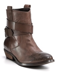 A buckle strap winds around the ankles of these booties, adding a hint of tough to the polished leather. By Aqua. A buckle strap winds around the ankles of these booties, adding a hint of tough to the polished leather. By Aqua.