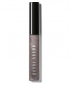 Infused with just a hint of pearly shimmer, this gives lips a subtle, glimmering look. Inspired by the play of pretty shades with an edgy twist, this gloss is part of Bobbi's Caviar & Oyster Collection and adds non-sticky shine to bare lips or your favorite lipstick. Formulated with aloe extract to soothe and soften lips; Vitamins C and E for anti-oxidant protection; and jojoba and avocado oils to moisturize lips. Made in USA. 