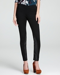Take charge of the equestrian trend in sleek DKNY leggings, accented with leather insets at the inner ankle for modern inspiration. Take charge of the equestrian trend in sleek DKNY leggings, accented with leather insets at the inner ankle for modern inspiration.