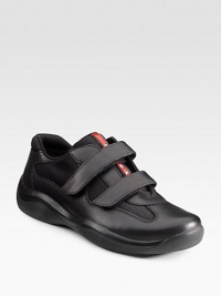Leather with mesh fabric, double grip-tape closure and logo detail. Padded insole Rubber sole Imported OUR FIT MODEL RECOMMENDS ordering true size.. Leather with mesh fabric, double grip-tape closure and logo detail. Padded insole Rubber sole Imported OUR FIT MODEL RECOMMENDS ordering true size..