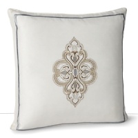 A Moroccan-inspired paisley print embroidered in soft hues on ivory cotton. A Moroccan-inspired paisley print embroidered in soft hues on ivory cotton.