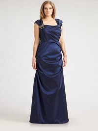 Adorned by a stunning brooch, this timeless, stretch taffeta design features a curve-friendly, pleated bodice and gathered side.Square necklineCap sleevesRhinestone broochBack waist dartsBack zipperAbout 45 from natural waist92% polyester/8% spandexDry cleanImported Adorned by a stunning brooch, this timeless, stretch taffeta design features a curve-friendly, pleated bodice and gathered side.Square necklineCap sleevesRhinestone broochBack waist dartsBack zipperAbout 45 from natural waist92% polyester/8% spandexDry cleanImported