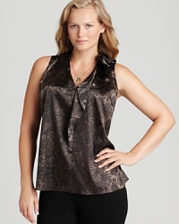 Rolling ruffles enliven a sleek snakeskin-print Tahari Woman Plus blouse for fierce fashion presence. Rolling ruffles enliven a sleek snakeskin-print Tahari Woman Plus blouse for fierce fashion presence.