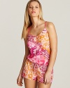 A bohemian swirling print romper with drawstring waist and tie details at back.