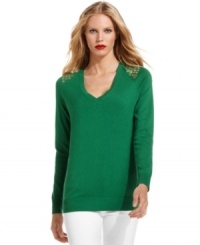 Shoulders full of shiny golden grommets gives this striking green sweater from MICHAEL Michael Kors chic appeal. Shoulders full of shiny golden grommets gives this striking green sweater from MICHAEL Michael Kors chic appeal.