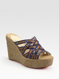 Grounded by a chunky espadrille wedge, printed silk straps take on a buckle-like form. Hemp wedge, 4 (100mm)Hemp platform, 1½ (40mm)Compares to a 2½ heel (65mm)Printed silk upperLeather liningSignature red leather solePadded insoleMade in SpainOUR FIT MODEL RECOMMENDS ordering one half size up as this style runs small. Grounded by a chunky espadrille wedge, printed silk straps take on a buckle-like form. Hemp wedge, 4 (100mm)Hemp platform, 1½ (40mm)Compares to a 2½ heel (65mm)Printed silk upperLeather liningSignature red leather solePadded insoleMade in SpainOUR FIT MODEL RECOMMENDS ordering one half size up as this style runs small.