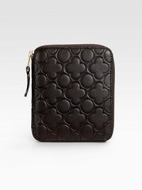 Chic, zip around design in supple leather has a clover-embossed exterior and a smooth surface interior. Zipper closure Snap coin purse Four credit card slots Leather lining 5W X 4H X 1D Made in Spain