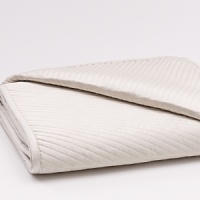 Prism is an artful blend of matte sheen and texture. Subtle dimension is created by the play of light against faceted geometric shapes which gently intersect with woven texture. Soft neutrals and cornsilk combine to soothe the senses. The duvet reverses to a textural stripe weave with subtle shimmer. Embroidery and pleating on decorative pillows underscores the refinement of the collection. Prism is an artful blend of matte sheen and texture. Subtle dimension is created by the play of light against faceted geometric shapes which gently intersect with woven texture. Soft neutrals and cornsilk combine to soothe the senses. The duvet reverses to a textural stripe weave with subtle shimmer. Embroidery and pleating on decorative pillows underscores the refinement of the collection.