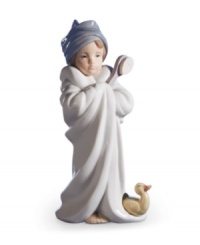 Bundled up after a bubble bath with her yellow baby duckie, this porcelain cutie is a charmer for your bathroom's cabinet or shelf. Handcrafted by Lladro.