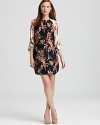 A lush floral print adorns this tunic-style 10 Crosby Derek Lam silk dress. Contrast sleeves add modern pop.