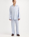 A luxurious cotton two-piece set, soft enough to lounge around in all night and day. Machine wash. Imported.SHIRTButtonfrontSpread collarChest, waist patch pocketsPANTSFlat-front styleAdjustable two-button waistSide elastic waist insetsNo flyInseam, about 31