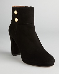 These commanding booties spell sophistication; metallic, military inspired buttons add some dash; from kate spade new york. These commanding booties spell sophistication; metallic, military inspired buttons add some dash; from kate spade new york.
