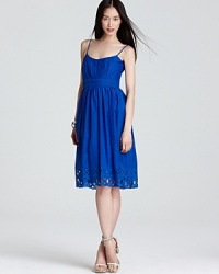 An intricate cutout pattern decorates the waist and hem of this frock from Jones New York Dress, emboldened by a stunning blue hue. An intricate cutout pattern decorates the waist and hem of this frock from Jones New York Dress, emboldened by a stunning blue hue.