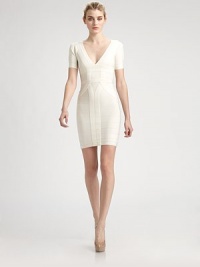 This sexy classic is enhanced with alluring splits along the shoulders.V necklineShort sleeves with split shouldersBandage constructionBack zipAbout 19 from natural waist90% rayon/9% nylon/1% spandexDry cleanImportedModel shown is 5'11 (180cm) wearing US size Small. This sexy classic is enhanced with alluring splits along the shoulders.V necklineShort sleeves with split shouldersBandage constructionBack zipAbout 19 from natural waist90% rayon/9% nylon/1% spandexDry cleanImportedModel shown is 5'11 (180cm) wearing US size Small.