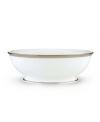 Metropolitan sensibility and modern design combine in this understated white bone china vegetable bowl from Lenox's collection of dinnerware and dishes. Platinum gild along the edge is enhanced by a clean, platinum geometric pattern reminiscent of architectural accents.
