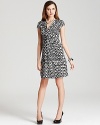 This chic DKNY dress ties together a punchy print and classic silhouette for timeless elegance.