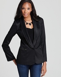 This GUESS blazer takes its inspiration from a tuxedo silhouette for evening-ready style. This GUESS blazer takes its inspiration from a tuxedo silhouette for evening-ready style.