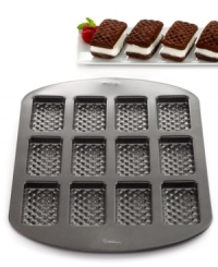 What the shouting is all about! Kick up your kitchen cred with this ice cream sandwich pan, which prepares this cool favorite with professional ease. Use the included recipe to whip up a batch of 12 mini cakes, pick your favorite ice cream center and have 6 tasty treats in no time at all-the kids are sure to come running! 10-year limited warranty. What the shouting is all about! Kick up your kitchen cred with this ice cream sandwich pan, which prepares this cool favorite with professional ease. Use the included recipe to whip up a batch of 12 mini cakes, pick your favorite ice cream center and have 6 tasty treats in no time at all-the kids are sure to come running! 10-year limited warranty.