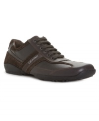Step up your everyday wardrobe with more sophisticated men's sneakers like this sleek paneled pick in smooth leather and suede fabric from Calvin Klein. Step up your everyday wardrobe with more sophisticated men's sneakers like this sleek paneled pick in smooth leather and suede fabric from Calvin Klein.