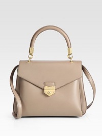 Smooth calfskin leather in a structured, lady-like frame with a detachable shoulder strap.Top handle, 4¾ dropDetachable shoulder strap, 17¾ dropFlap clasp closureOne outside open pocket under flapOne inside zip pocketCotton lining12W X 8¾H X 3DMade in Italy Smooth calfskin leather in a structured, lady-like frame with a detachable shoulder strap.Top handle, 4¾ dropDetachable shoulder strap, 17¾ dropFlap clasp closureOne outside open pocket under flapOne inside zip pocketCotton lining12W X 8¾H X 3DMade in Italy