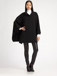 Rich wool fleece in a draped poncho style updated with a ribbed zip collar.Foldover collarDropped shouldersOpen sleevesPullover styleWoolDry cleanImportedModel shown is 5'11 (180cm) wearing US size Small.