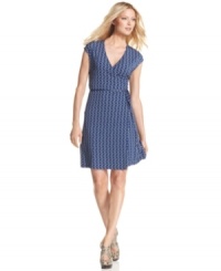 MICHAEL Michael Kors' dress is decked out with a chain print and a faux-wrap silhouette for a classic, sophisticated look. MICHAEL Michael Kors' dress is decked out with a chain print and a faux-wrap silhouette for a classic, sophisticated look.