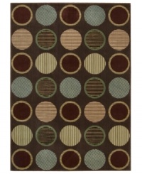 Design that's spot on. This marvelously modern area rug bursts forth from your floor with row upon row of textured circles, presented in appealing colors on a deep chocolate ground, and hand-carved to add that extra, eye-catching dimension. Design that's spot on. This marvelously modern area rug bursts forth from your floor with row upon row of textured circles, presented in appealing colors on a deep chocolate ground, and hand-carved to add that extra, eye-catching dimension.