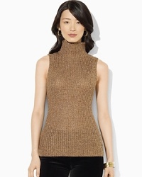 A soft knit sweater is a layering essential, crafted in a sleeveless silhouette. A soft knit sweater is a layering essential, crafted in a sleeveless silhouette.