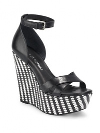THE LOOKCrisscross leather top strapsAdjustable ankle strap with buckleTwo-tone woven leather wedge, 5(125mm)Two-tone woven leather platform, 2(50mm)Compares to a 3 heel(75mm)Padded insoleTHE MATERIALLeather upperLeather lining and soleORIGINImported THE LOOKCrisscross leather top strapsAdjustable ankle strap with buckleTwo-tone woven leather wedge, 5(125mm)Two-tone woven leather platform, 2(50mm)Compares to a 3 heel(75mm)Padded insoleTHE MATERIALLeather upperLeather lining and soleORIGINImported