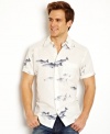 Cast out your old summer attire and reel in this short-sleeved fish graphic shirt from Nautica.