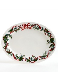 Guests will appreciate the festive look of your holiday table, compliments of Martha Stewart Collection. Graceful boughs of holly and vibrant red ribbons decorate this porcelain oval platter for a joyful look. Guests will appreciate the festive look of your holiday table, compliments of Martha Stewart Collection. Graceful boughs of holly and vibrant red ribbons decorate this porcelain oval platter for a joyful look.