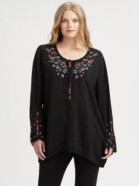 Beautifully woven and featuring exquisite embroidery, a tunic offering a relaxed fit that will work wonderfully with slim-fitting pants.Self-tie detail at embroidered necklineLong sleevesPull-on styleAbout 34 from shoulder to hemRayonMachine washImported Beautifully woven and featuring exquisite embroidery, a tunic offering a relaxed fit that will work wonderfully with slim-fitting pants.Self-tie detail at embroidered necklineLong sleevesPull-on styleAbout 34 from shoulder to hemRayonMachine washImported