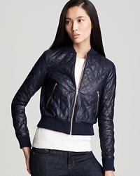 Crafted from sumptuous lambskin leather, this classically-quilted leather Theory jacket boasts a feminine, cropped silhouette with glamorous gold zipper details. Crafted from sumptuous lambskin leather, this classically-quilted leather Theory jacket boasts a feminine, cropped silhouette with glamorous gold zipper details.