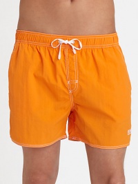 With stitched details and a grip-tape back patch pocket, these stylish swim trunks are both sporty and functional.Elastic drawstring waistStich detail at flySlash side pocketsBack grip-tape patch pocketInseam, about 4½PolyamideMachine washImported With stitched details and a grip-tape back patch pocket, these stylish swim trunks are both sporty and functional.Elastic drawstring waistStich detail at flySlash side pocketsBack grip-tape patch pocketInseam, about 4½PolyamideMachine washImported