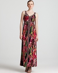 A rush of tropical florals, this Calvin Klein maxi dress blends prints big and small for the perfect fashion mash-up. A rush of tropical florals, this Calvin Klein maxi dress blends prints big and small for the perfect fashion mash-up.
