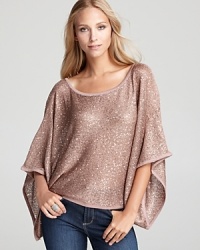 Dripping with dazzling sequins, a Shiloh770 sweater steals the spotlight with statement batwing sleeves. Dripping with dazzling sequins, a Shiloh770 sweater steals the spotlight with statement batwing sleeves.