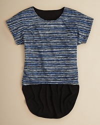 Rich Ikat stripe print draws the eye to this cute top, and the dramatic solid chiffon back turns up the drama with a dramatic drop-tail hem. Rich Ikat stripe print draws the eye to this cute top, and the dramatic solid chiffon back turns up the drama with a dramatic drop-tail hem.