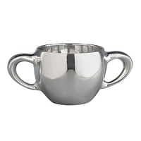 Nambé two handles design has a soft flowing design. Easy to hold, functionaland beautiful. Has a modern look for a traditional gift. Perfect gift for the new addition to yourfamily. This gift will be passed down as a family heirloom. Part of the Nambé Baby Collection, pairwith any part of this collection. Can be engraved for a personal touch in gift giving. Designed by Sean O'Hara. Nambé two handles design has a soft flowing design. Easy to hold, functionaland beautiful. Has a modern look for a traditional gift. Perfect gift for the new addition to yourfamily. This gift will be passed down as a family heirloom. Part of the Nambé Baby Collection, pairwith any part of this collection. Can be engraved for a personal touch in gift giving. Designed by Sean O'Hara.
